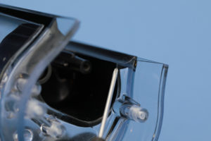 This face is painted to reduce false triggering of the IR reflective sensor, you can also see the bosses used for mounting of the motor and gear pump