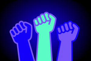 3 different coloured fists raised in solidarity